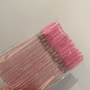 Unopened pack of eyebrow brush/ mascara wands (about 50)